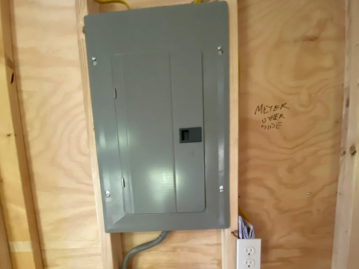 New electrical service panel and conduit run installed by Chair City Electric